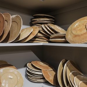installation of 700 plates made of bread/ wooden shelves, bread dough,variation of 1000-1699